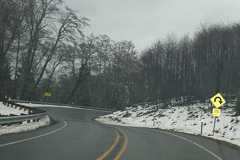 Curvy winter road signposted 15 mph near Port Angeles