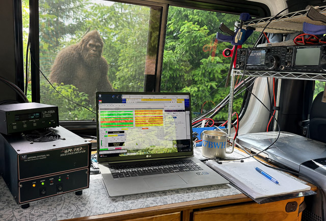 Interior view of rover van showing desk and radio equipment.